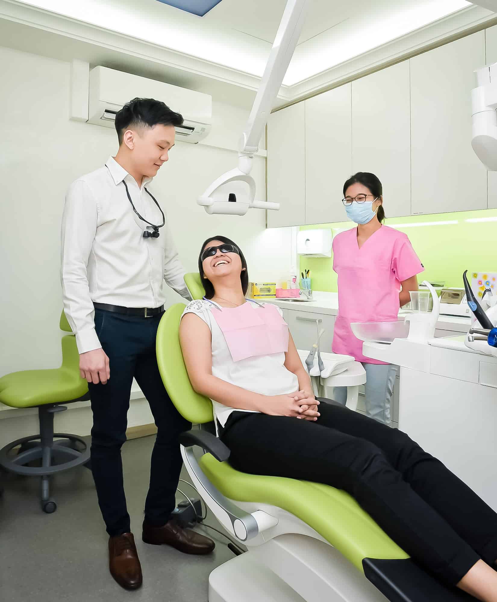 Patient check-up with Dr Russell and dental nurse