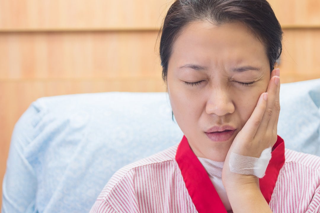 Female patients with toothache in the hospital room. To get a root canal treatment.