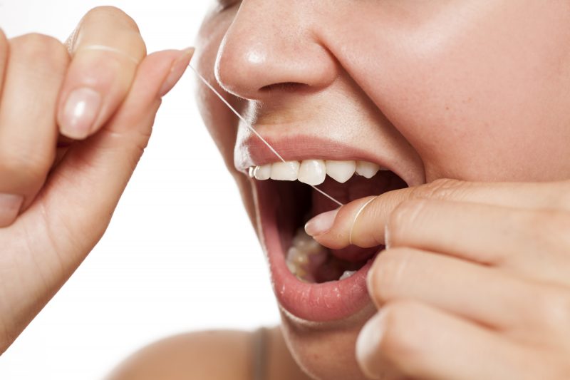 flossing is a way to adopt good oral hygiene habits