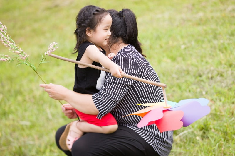 Kids Dentist Singapore - child hugging her mother